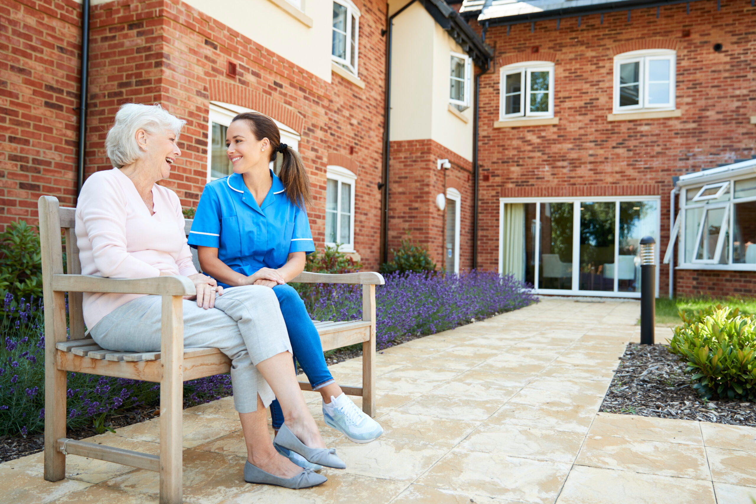 Senior Woman Sitting On Bench