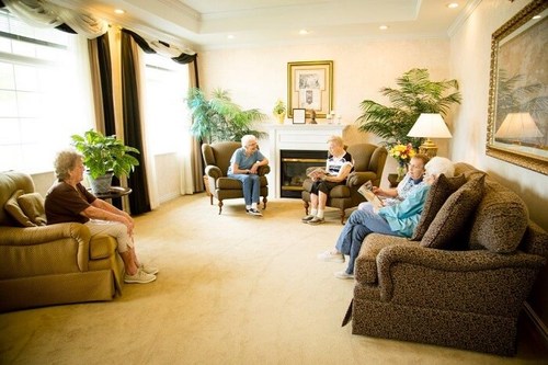 Elderly group sitting in living area